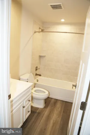 a bathroom with a sink a toilet and a bathtub