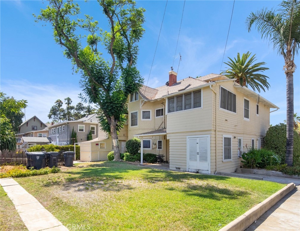 305 West Olive Avenue Redlands, CA 92373 - Photo 12 of 16 a house with swimming pool in front of it