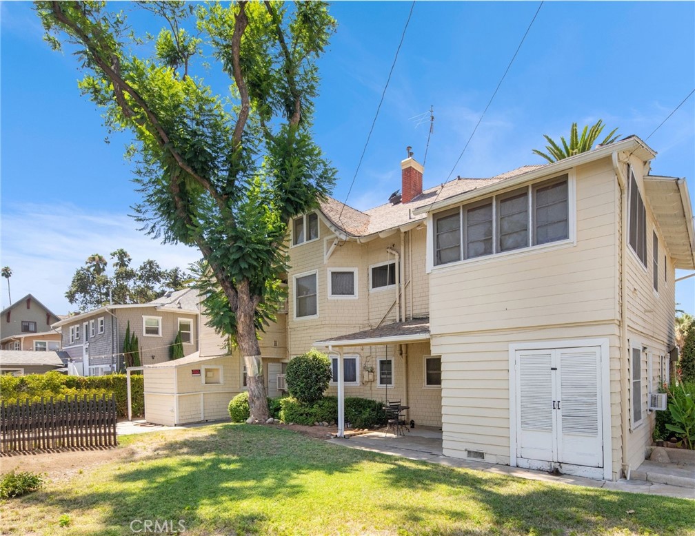 305 West Olive Avenue Redlands, CA 92373 - Photo 13 of 16 a front view of a house with a yard