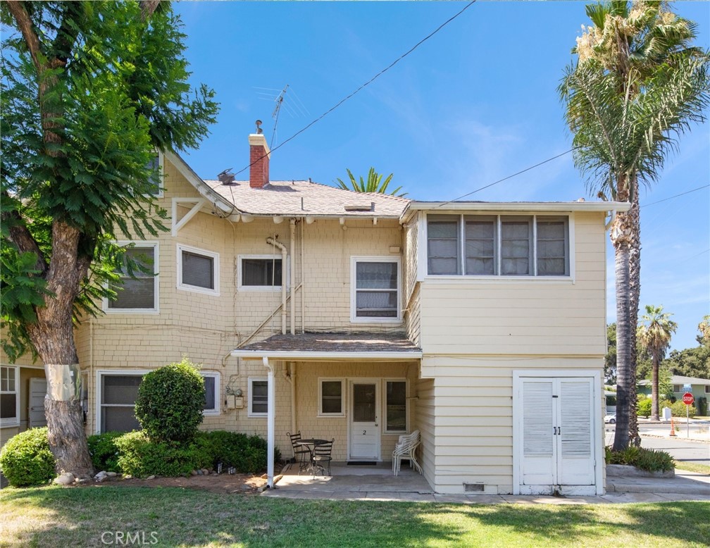 305 West Olive Avenue Redlands, CA 92373 - Photo 14 of 16 front view of a house with a yard