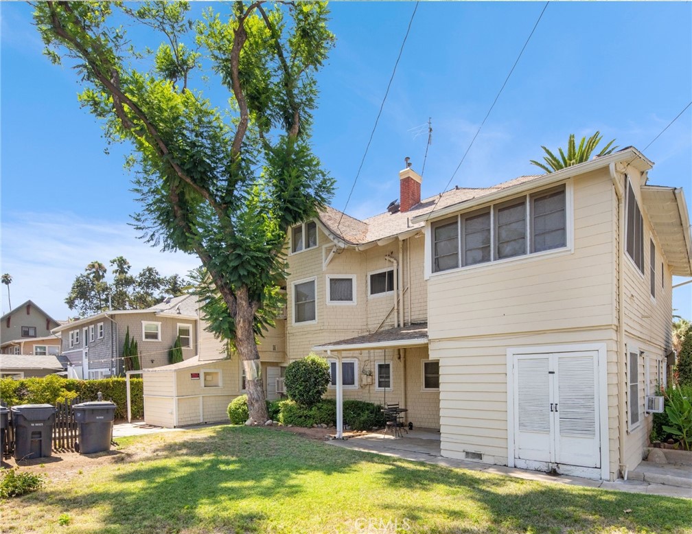 305 West Olive Avenue Redlands, CA 92373 - Photo 15 of 16 a view of a house with a swimming pool