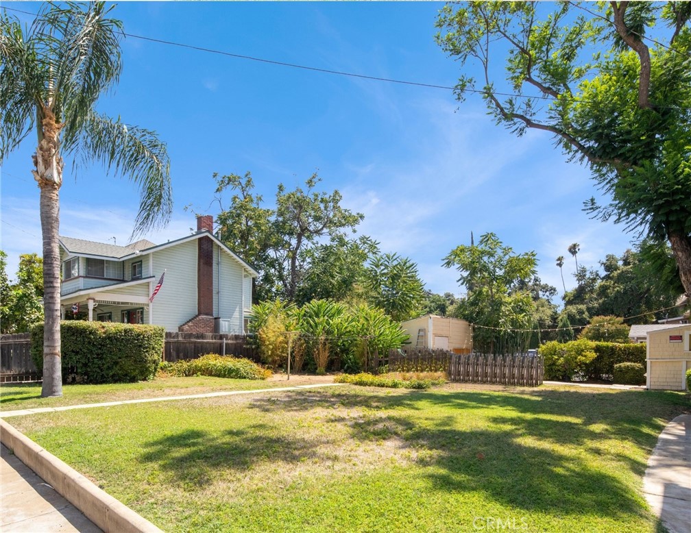 305 West Olive Avenue Redlands, CA 92373 - Photo 10 of 16 a view of a house with pool and a yard
