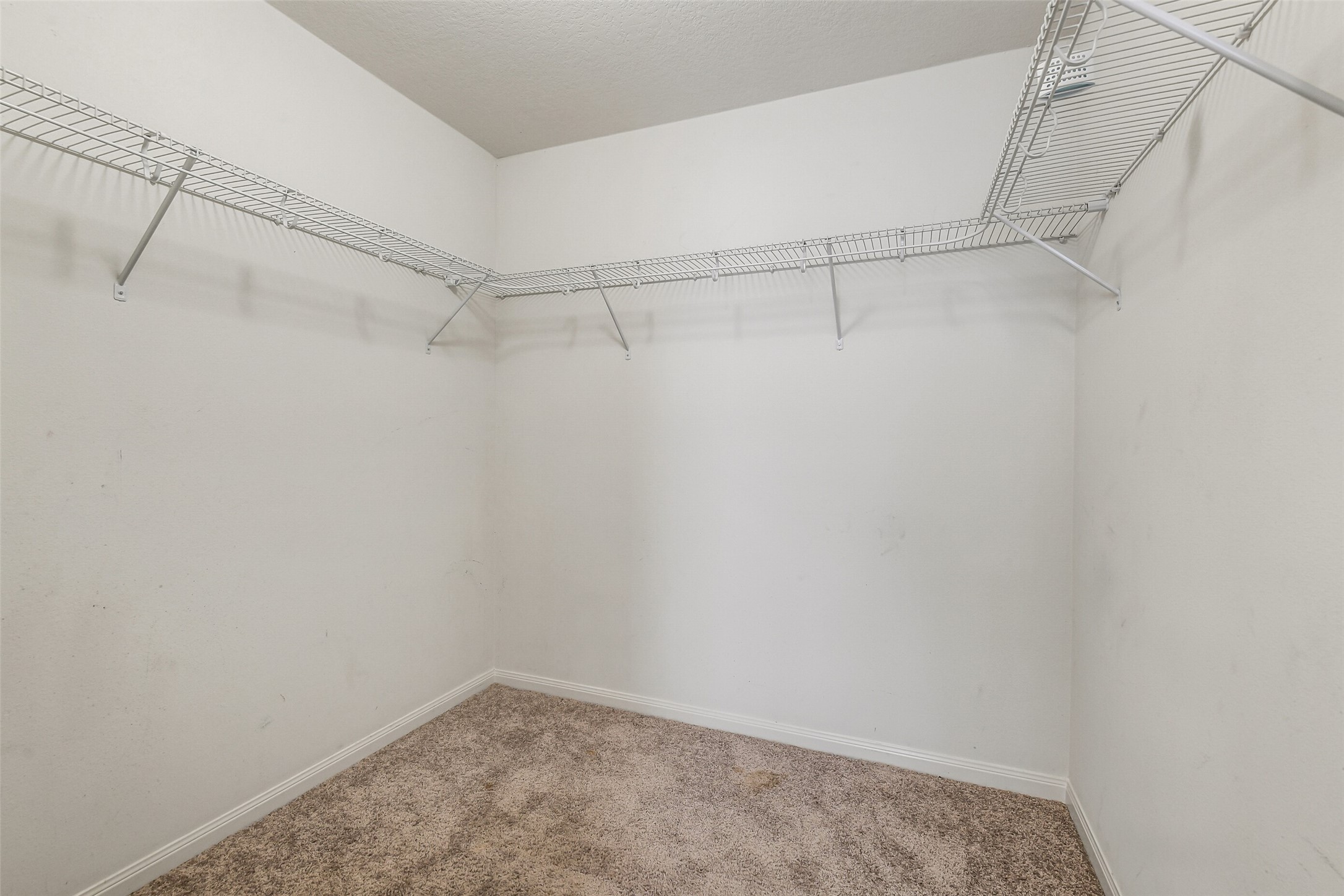 22719 Tabberts Way Hockley, TX 77447 - Photo 19 of 28 a view of a room with racks on the wall