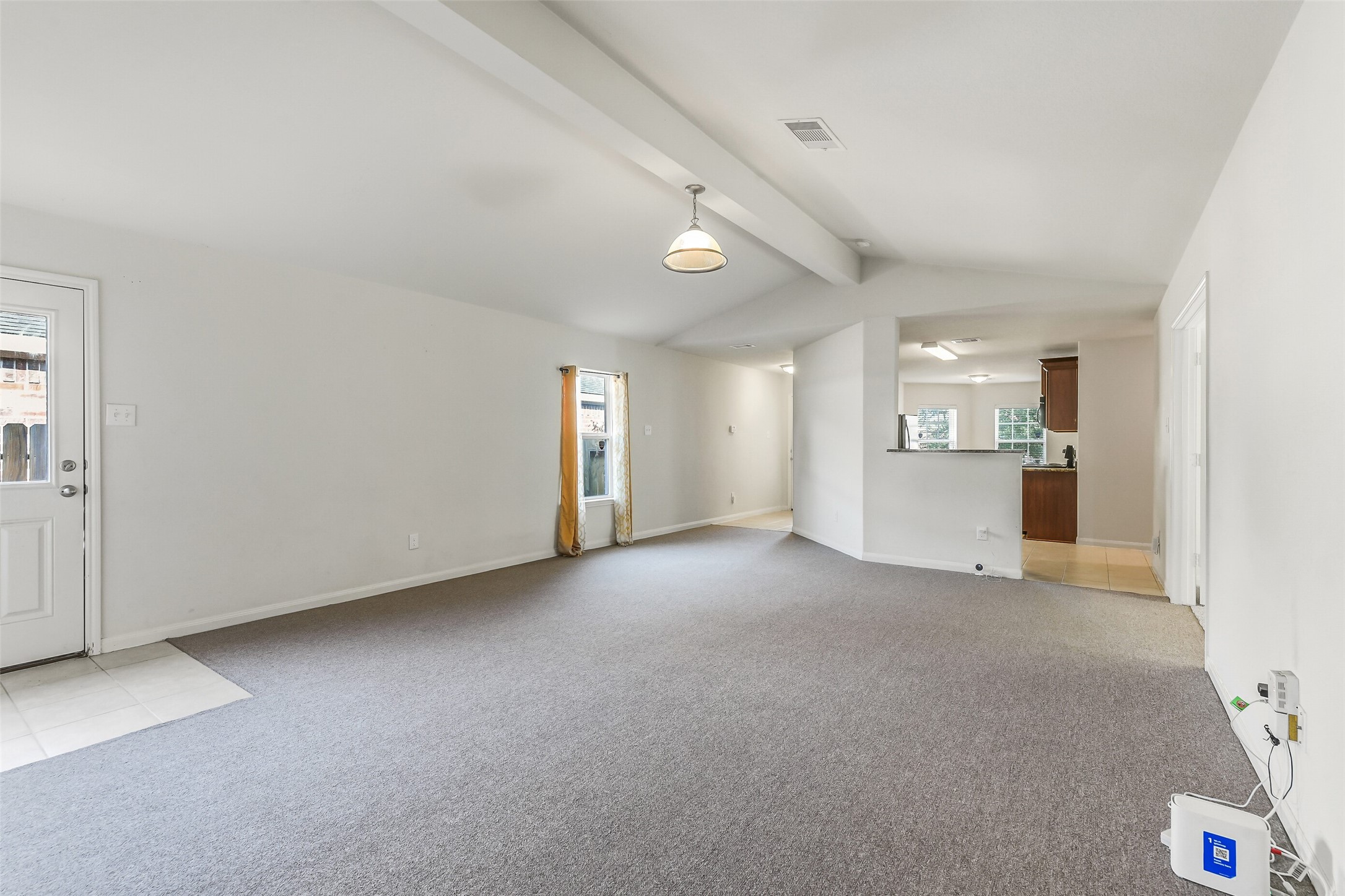 22719 Tabberts Way Hockley, TX 77447 - Photo 4 of 28 an empty room with windows and cabinet