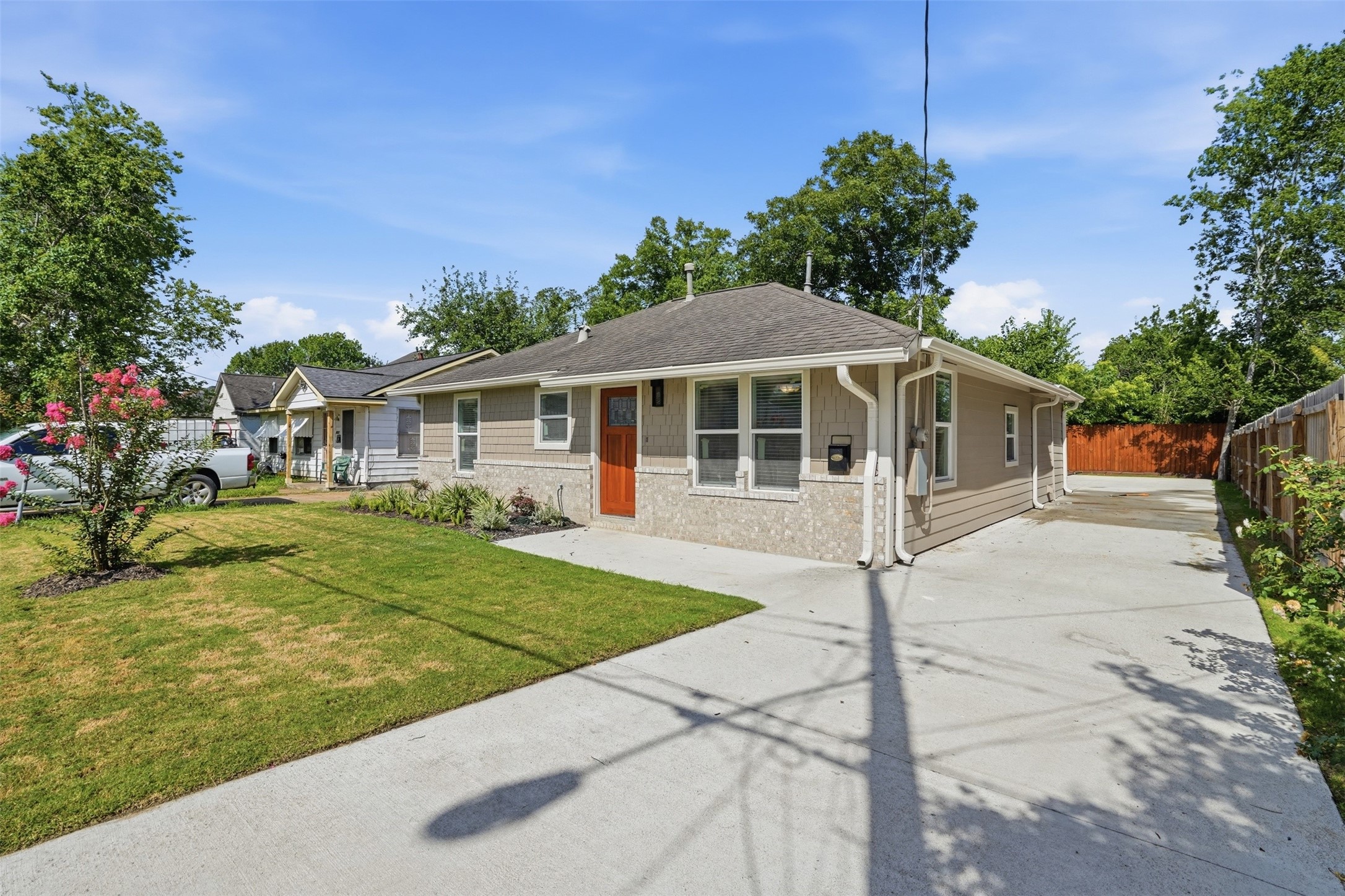 a front view of a house with garden