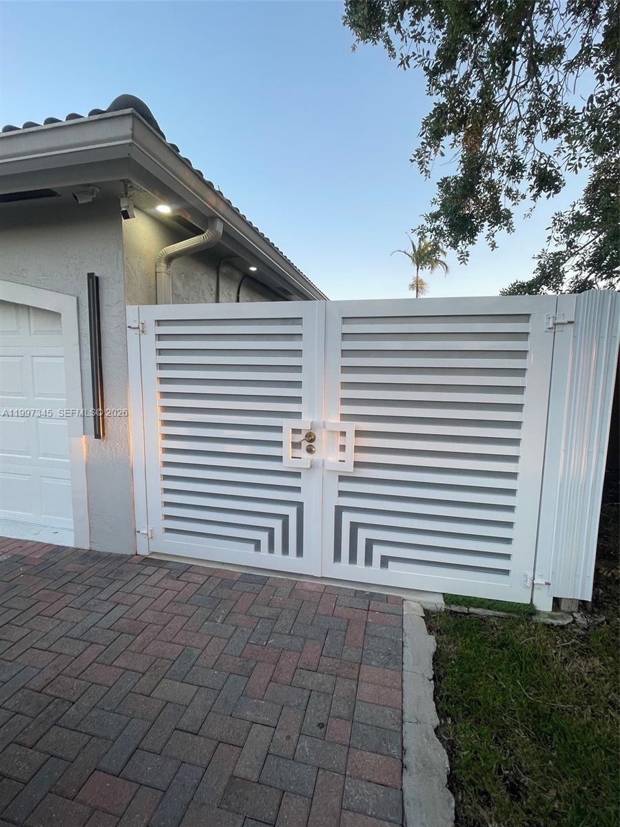 15426 Southwest 168th Terrace, Unit 2 Miami, FL 33187 - Photo 9 of 12 a view of a house with a garage