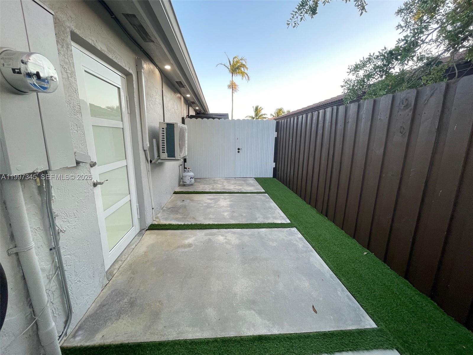 15426 Southwest 168th Terrace, Unit 2 Miami, FL 33187 - Photo 10 of 12 a view of a back yard