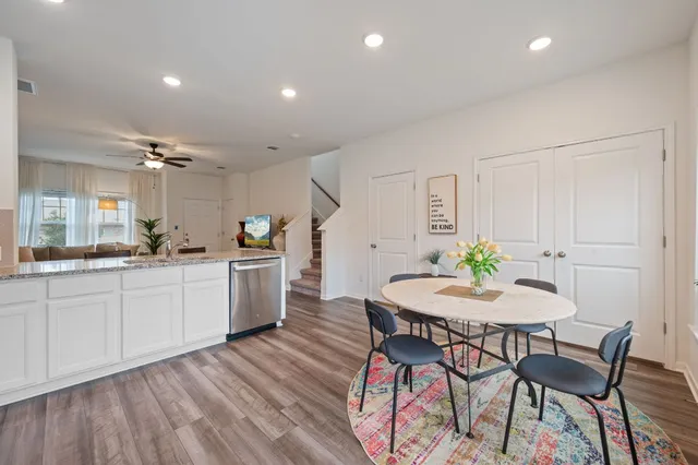 a kitchen with a table and chairs in it