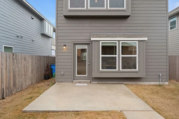 a front view of a house with parking space