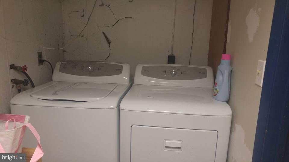 923 Calwell Road Baltimore, MD 21229 - Photo 14 of 14 a utility room with dryer and washer