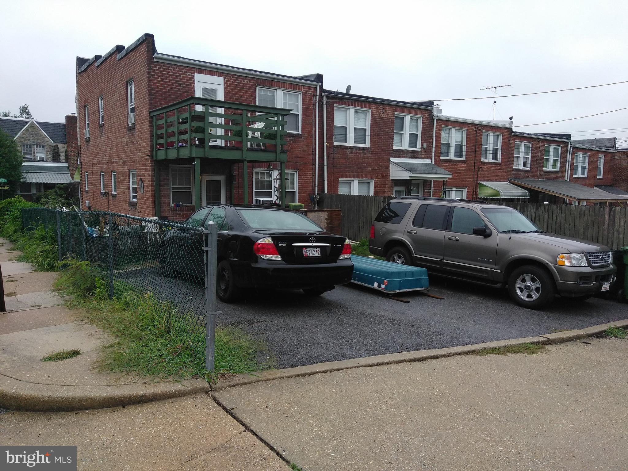 923 Calwell Road Baltimore, MD 21229 - Photo 3 of 14 a car parked in front of a brick building