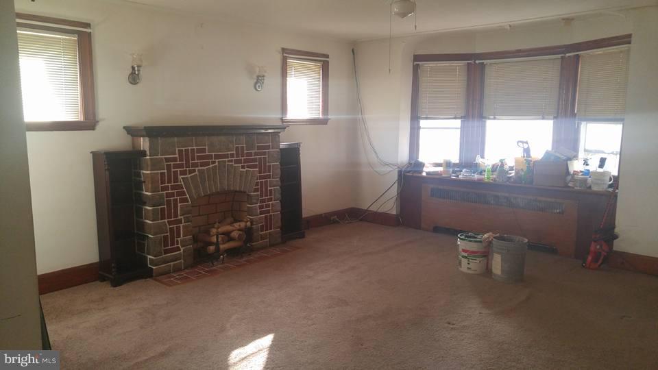 923 Calwell Road Baltimore, MD 21229 - Photo 4 of 14 a view of a livingroom with furniture and windows
