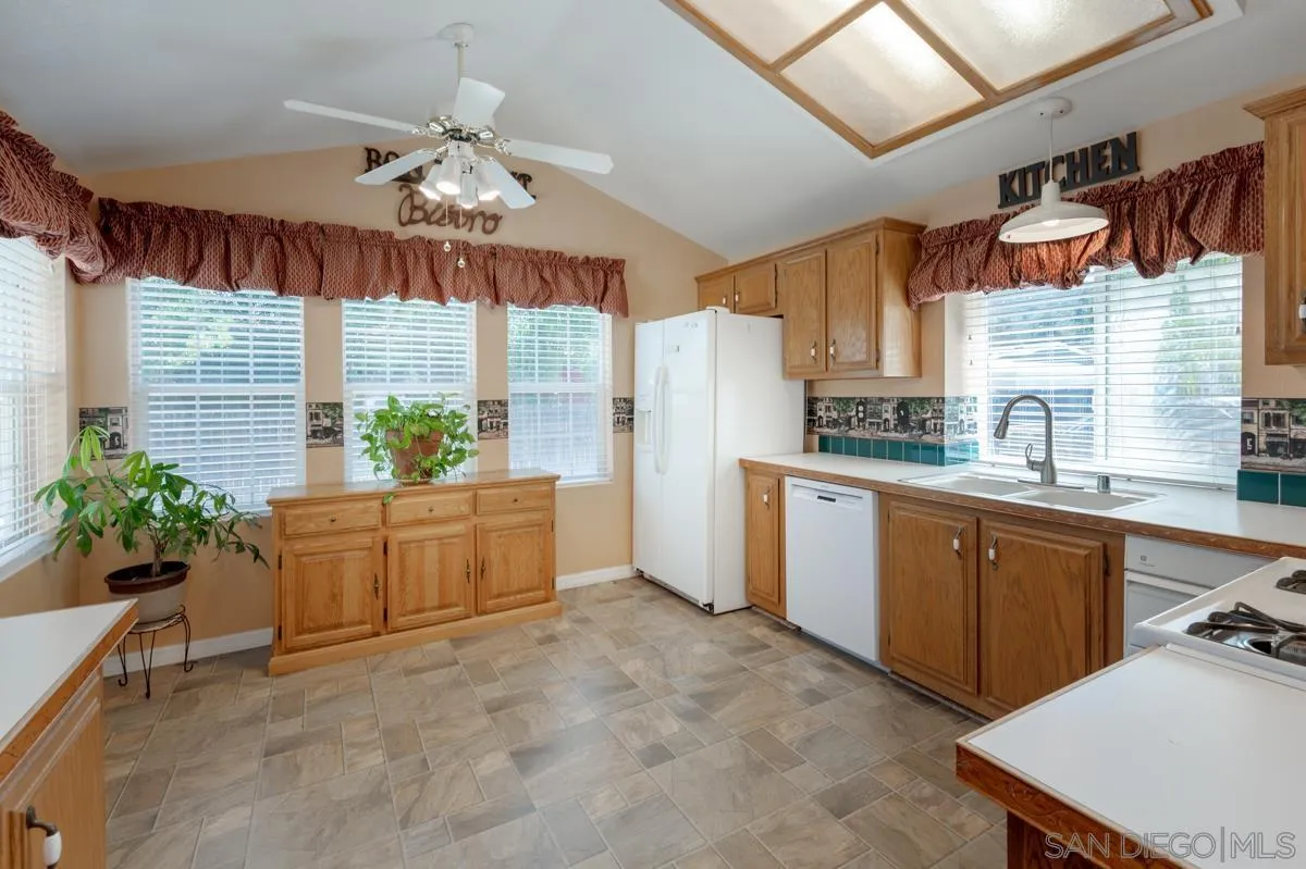 15935 Spring Oaks Road, Unit 122 El Cajon, CA 92021 - Photo 11 of 30 a kitchen with sink cabinets and window
