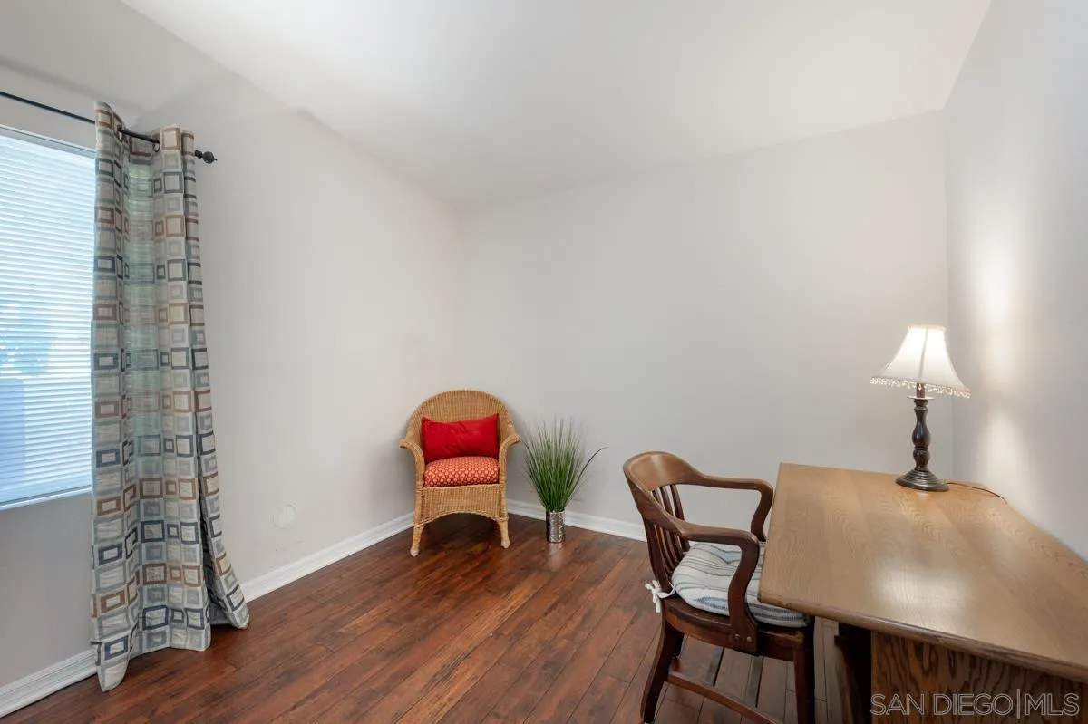 15935 Spring Oaks Road, Unit 122 El Cajon, CA 92021 - Photo 21 of 30 a dining room with furniture and wooden floor
