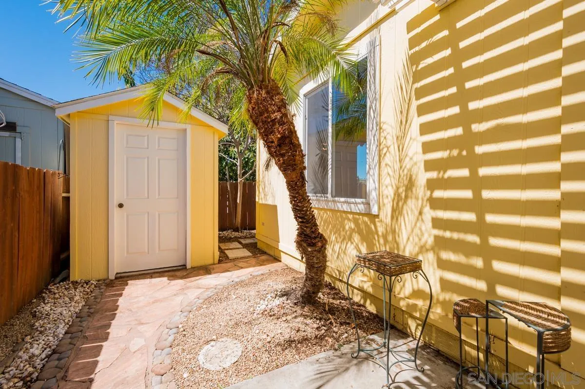 15935 Spring Oaks Road, Unit 122 El Cajon, CA 92021 - Photo 27 of 30 a view of a house with a yard and sitting area