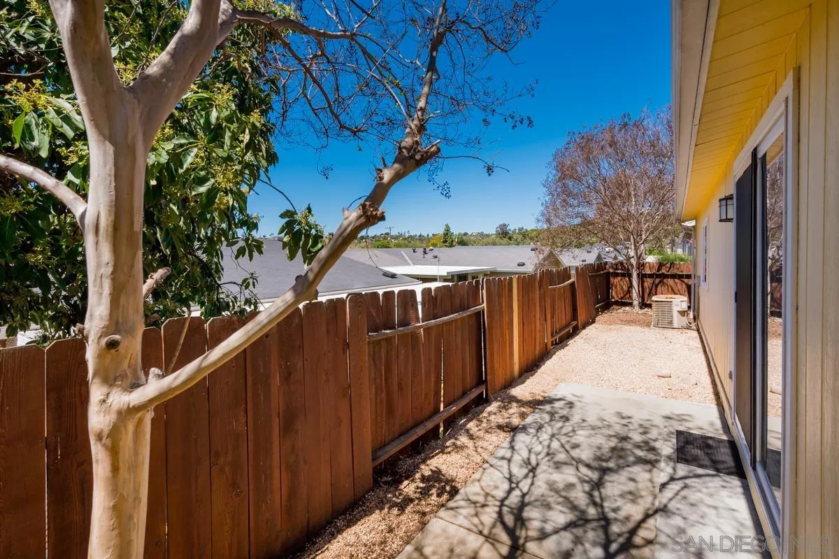 15935 Spring Oaks Road, Unit 122 El Cajon, CA 92021 - Photo 29 of 30 a view of a pathway with a wrought fence