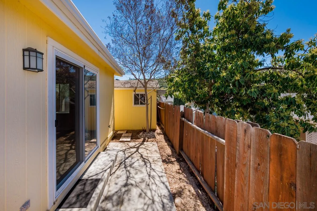 15935 Spring Oaks Road, Unit 122 El Cajon, CA 92021 - Photo 30 of 30 a view of balcony with wooden floor and fence