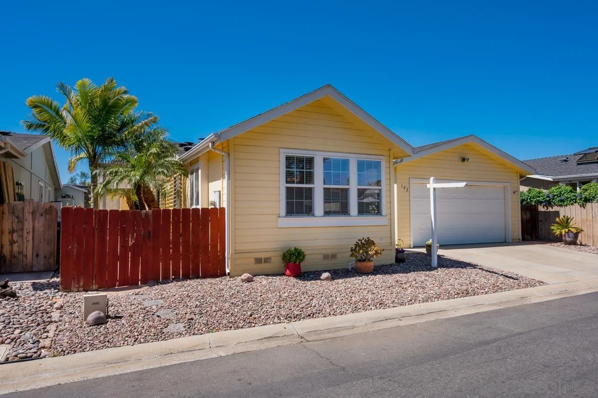 15935 Spring Oaks Road, Unit 122 El Cajon, CA 92021 - Photo 3 of 30 a front view of a house with a yard