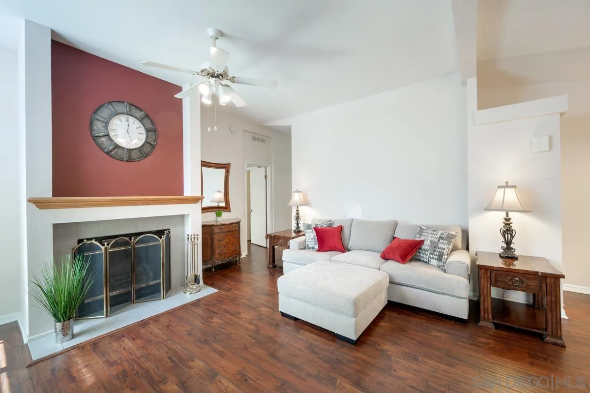 15935 Spring Oaks Road, Unit 122 El Cajon, CA 92021 - Photo 6 of 30 a living room with furniture a fireplace and a flat screen tv