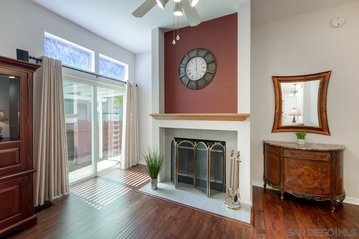15935 Spring Oaks Road, Unit 122 El Cajon, CA 92021 - Photo 7 of 30 a view of a livingroom with a fireplace and wooden floor