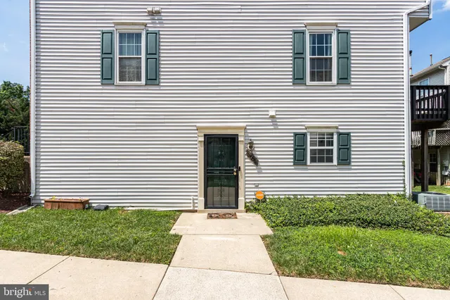a view of a house and a yard