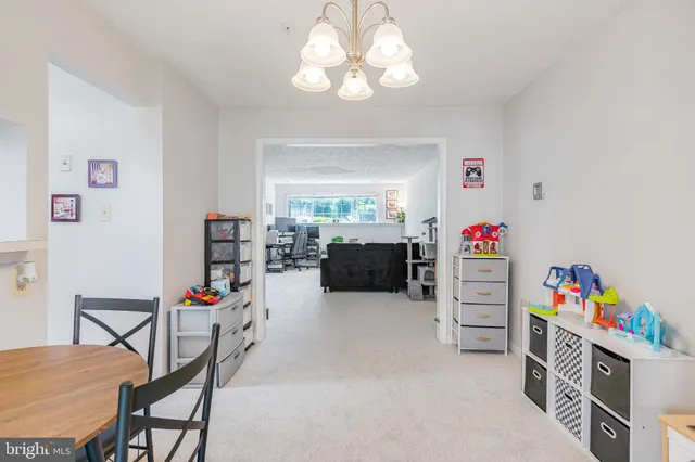 a play room with furniture and a baby crib