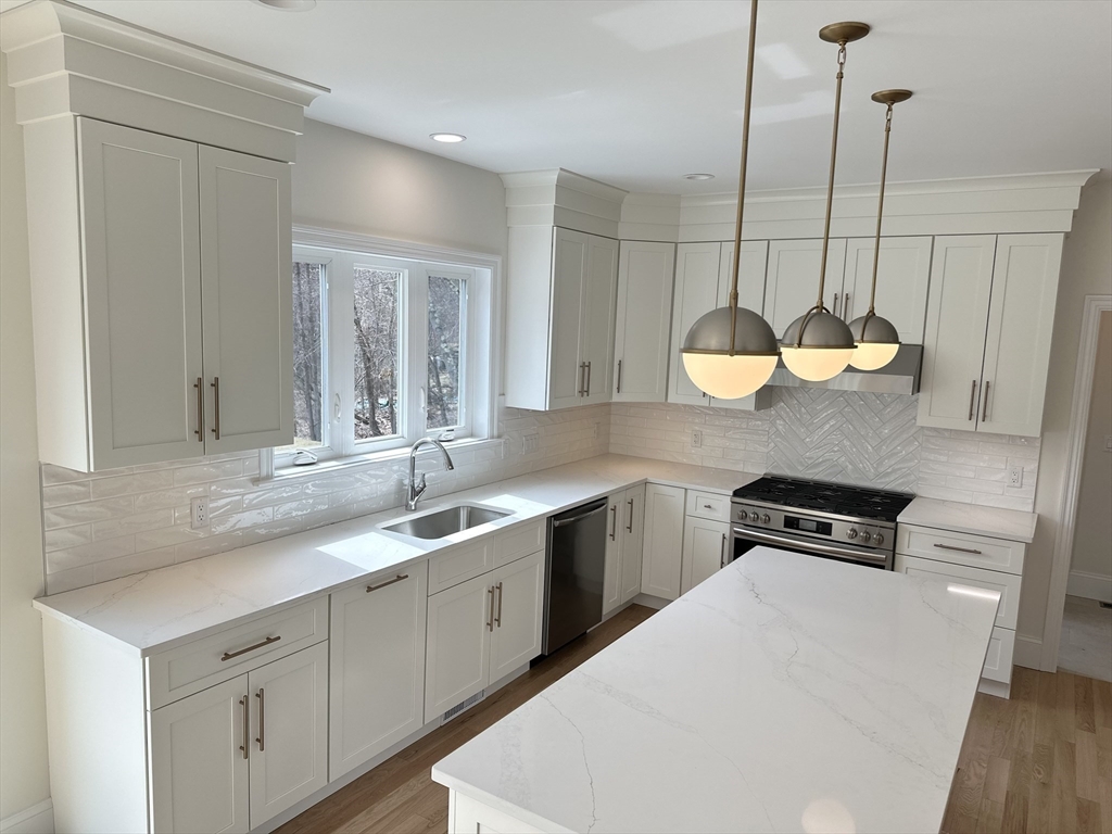 2 Libbey Lane Grafton, MA 01536 - Photo 2 of 18 a kitchen with a sink a counter space appliances and cabinets