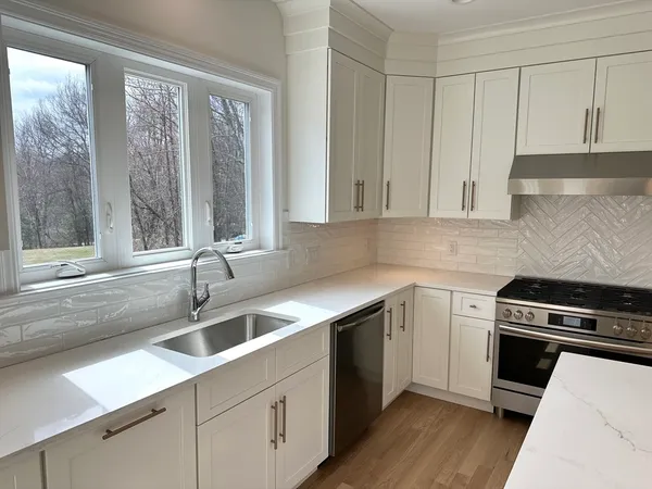 a kitchen with a sink and cabinets
