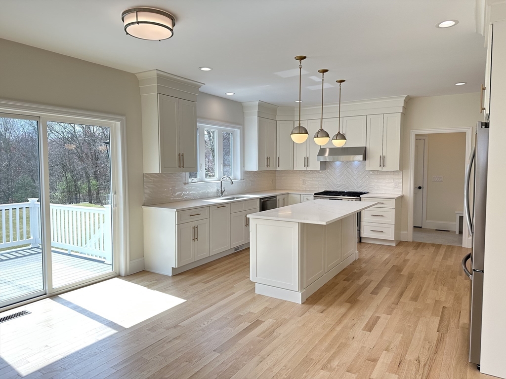 2 Libbey Lane Grafton, MA 01536 - Photo 6 of 18 a kitchen with a refrigerator a sink and cabinets