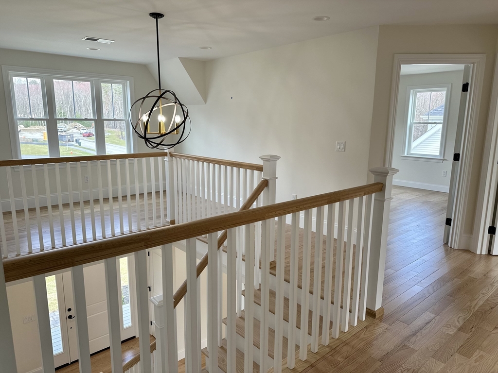 2 Libbey Lane Grafton, MA 01536 - Photo 10 of 18 a view of staircase with railing and wooden floor