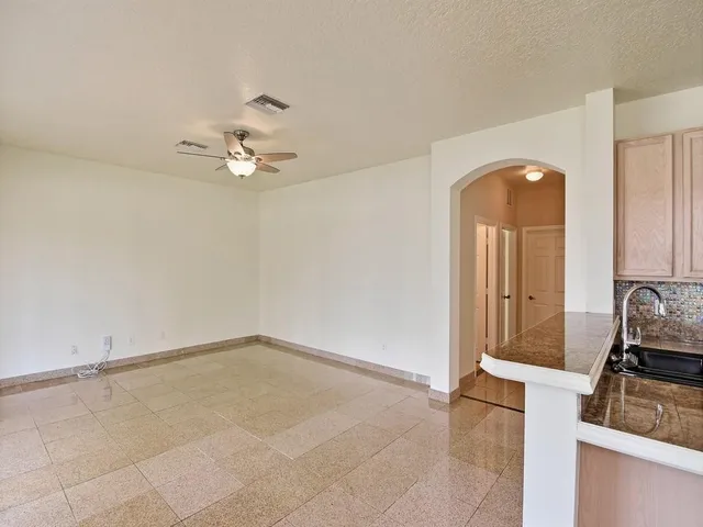 a very nice looking room with a ceiling fan