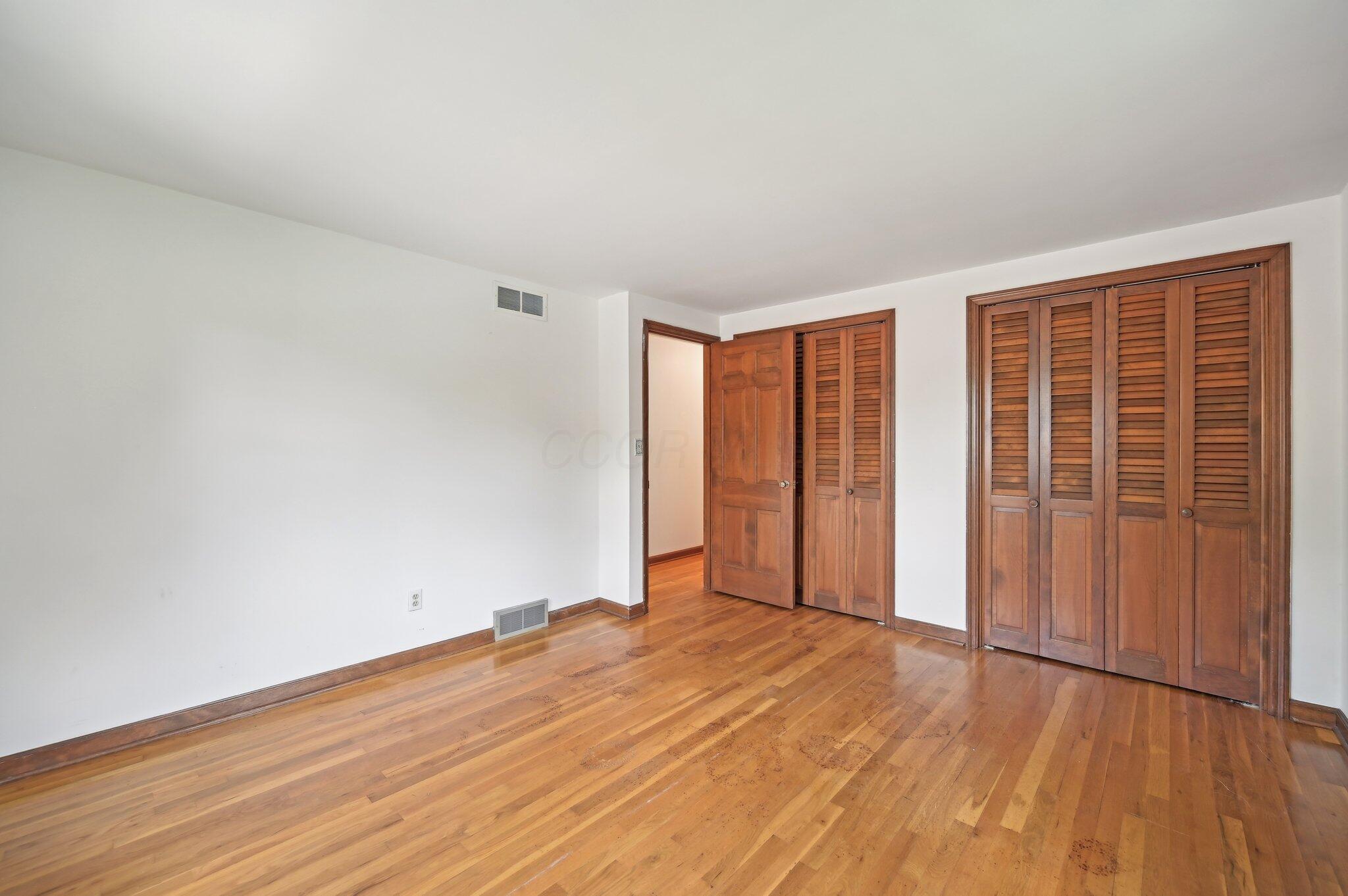 5917 Rocky Rill Road Columbus, OH 43235 - Photo 34 of 47 Bedroom 2 (Alternate View)
A view from the opposite corner shows double closets with wood louvered doors and easy hallway access.