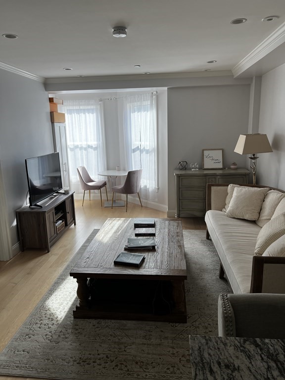 296 Beacon Street, Unit 7 Boston, MA 02116 - Photo 11 of 21 a living room with furniture and a window