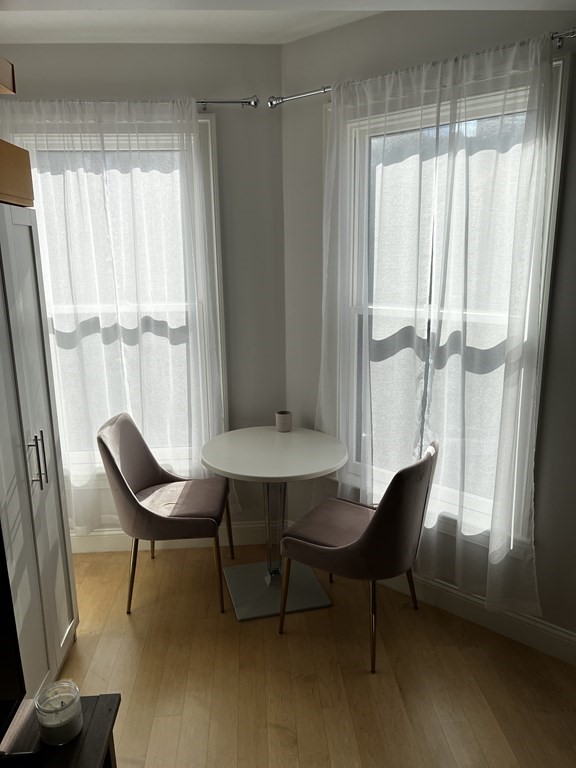 296 Beacon Street, Unit 7 Boston, MA 02116 - Photo 18 of 21 a view of a room with a window and wooden floor