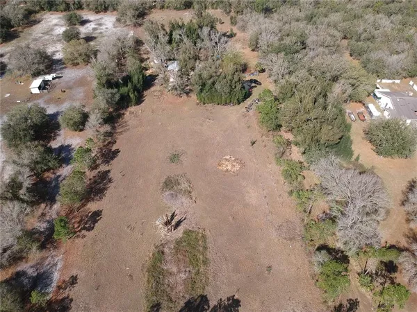 a view of mountains in between of the forest