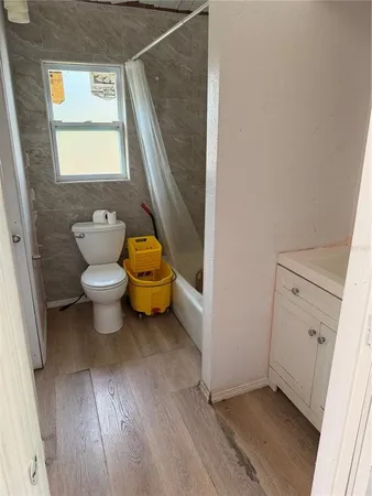 a bathroom with a toilet sink and a window