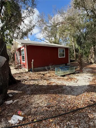 a view of a backyard of the house