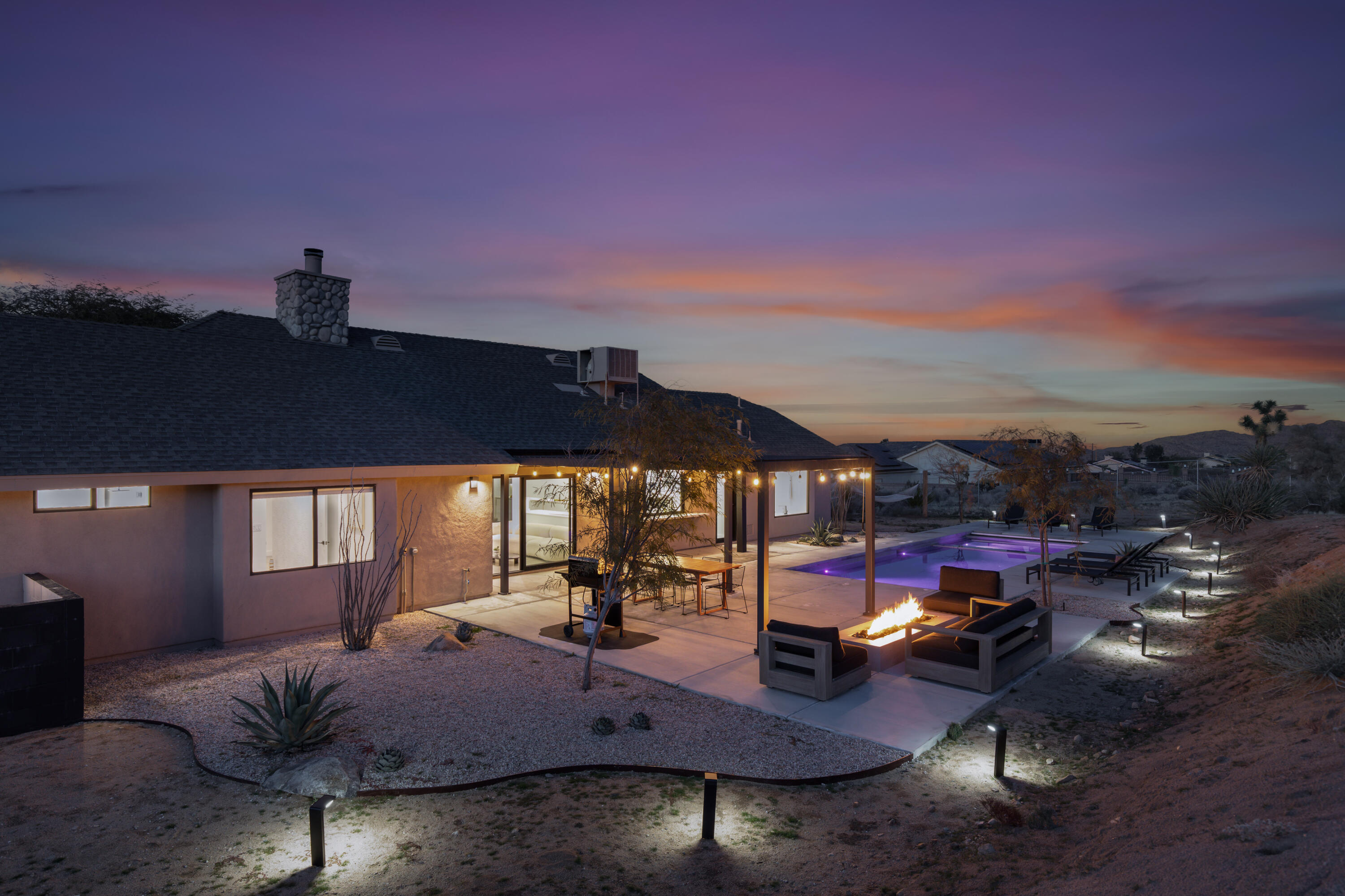 60633 Pueblo Trail Joshua Tree, CA 92252 - Photo 11 of 65 a view of a livingroom with furniture hardwood floor and a city view