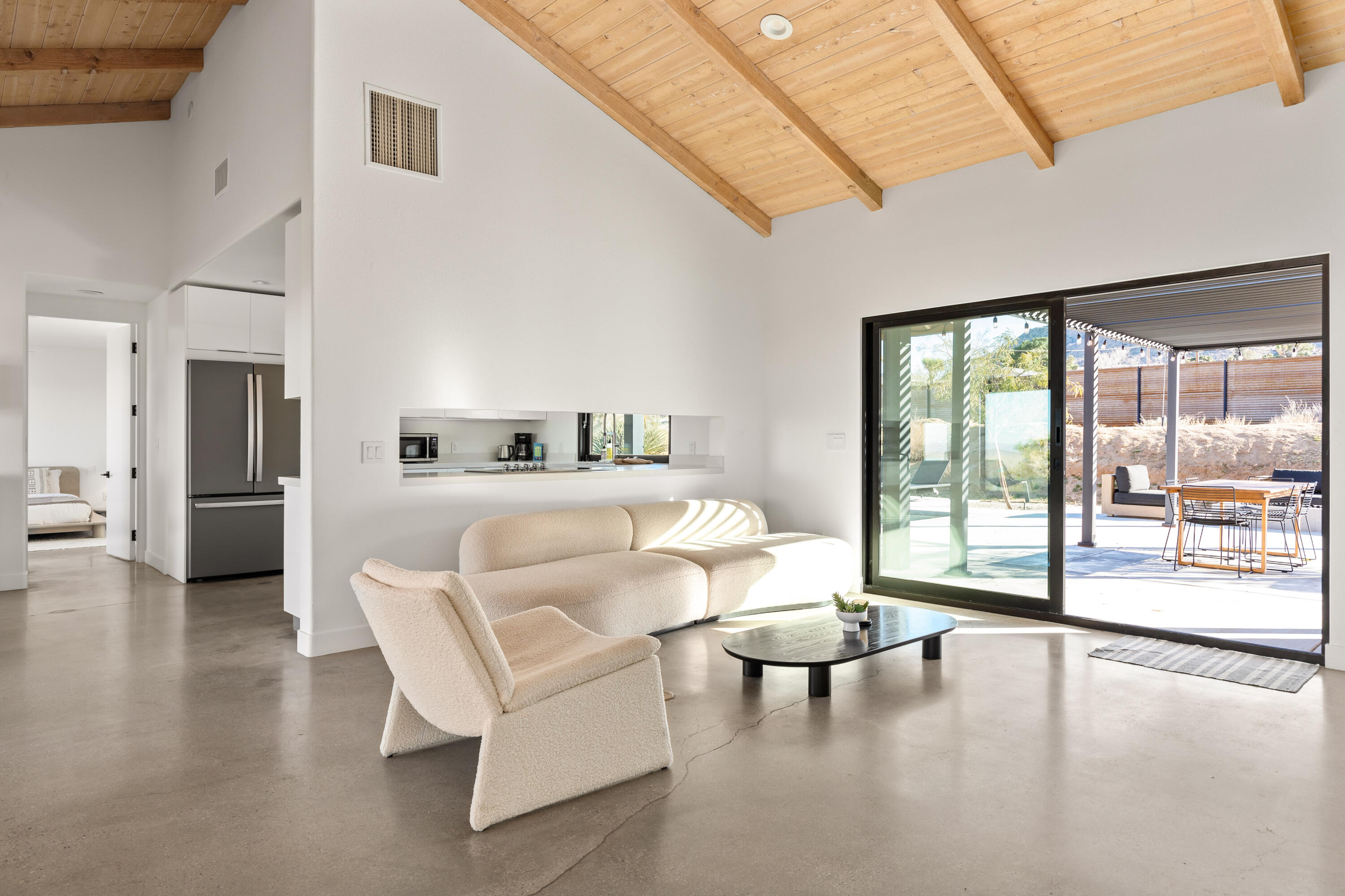 60633 Pueblo Trail Joshua Tree, CA 92252 - Photo 20 of 65 a living room with furniture and a large window