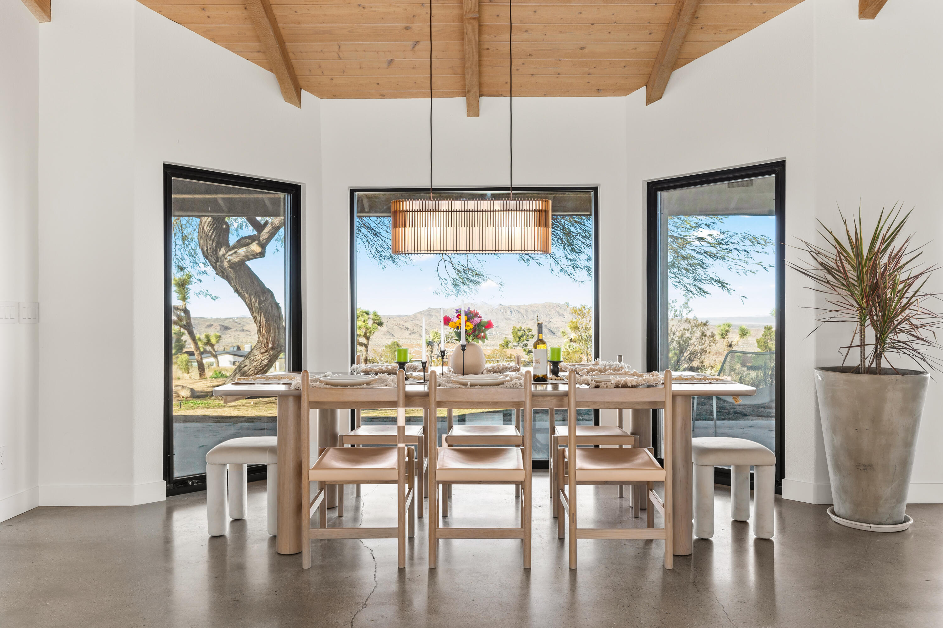 60633 Pueblo Trail Joshua Tree, CA 92252 - Photo 22 of 65 a view of a dining room with furniture window and wooden floor