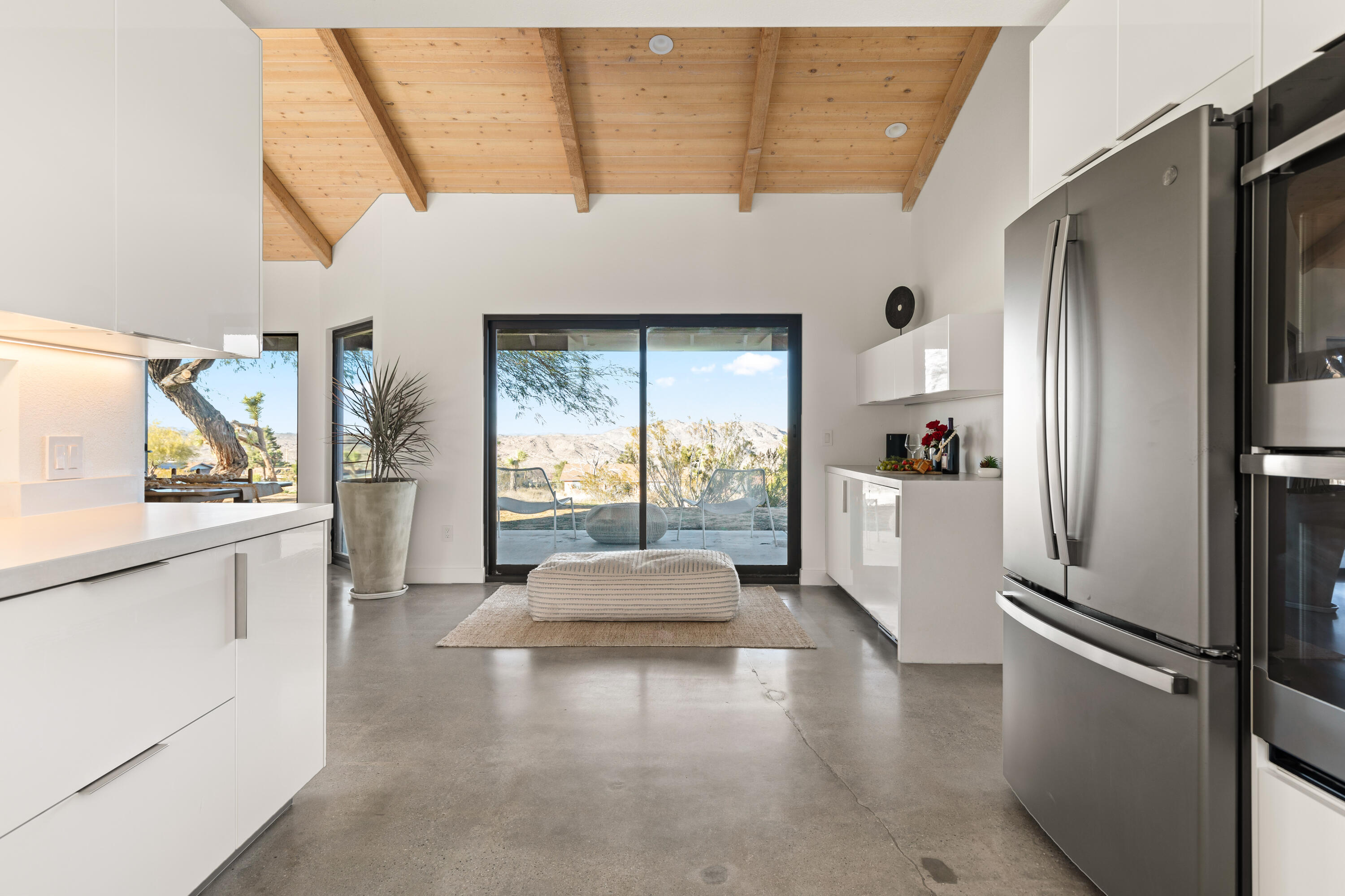 60633 Pueblo Trail Joshua Tree, CA 92252 - Photo 29 of 65 a kitchen with a refrigerator and white cabinets