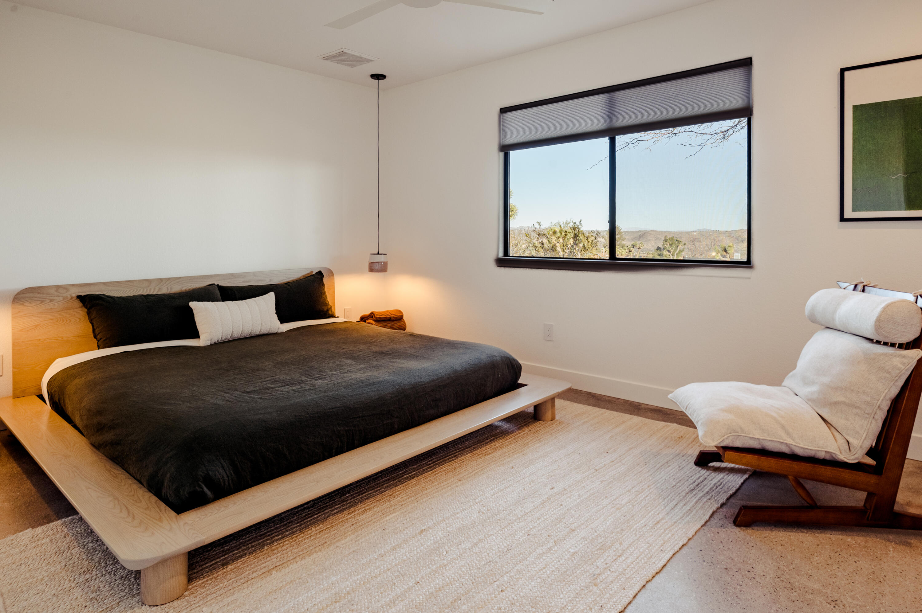 60633 Pueblo Trail Joshua Tree, CA 92252 - Photo 38 of 65 a bedroom with a bed and window