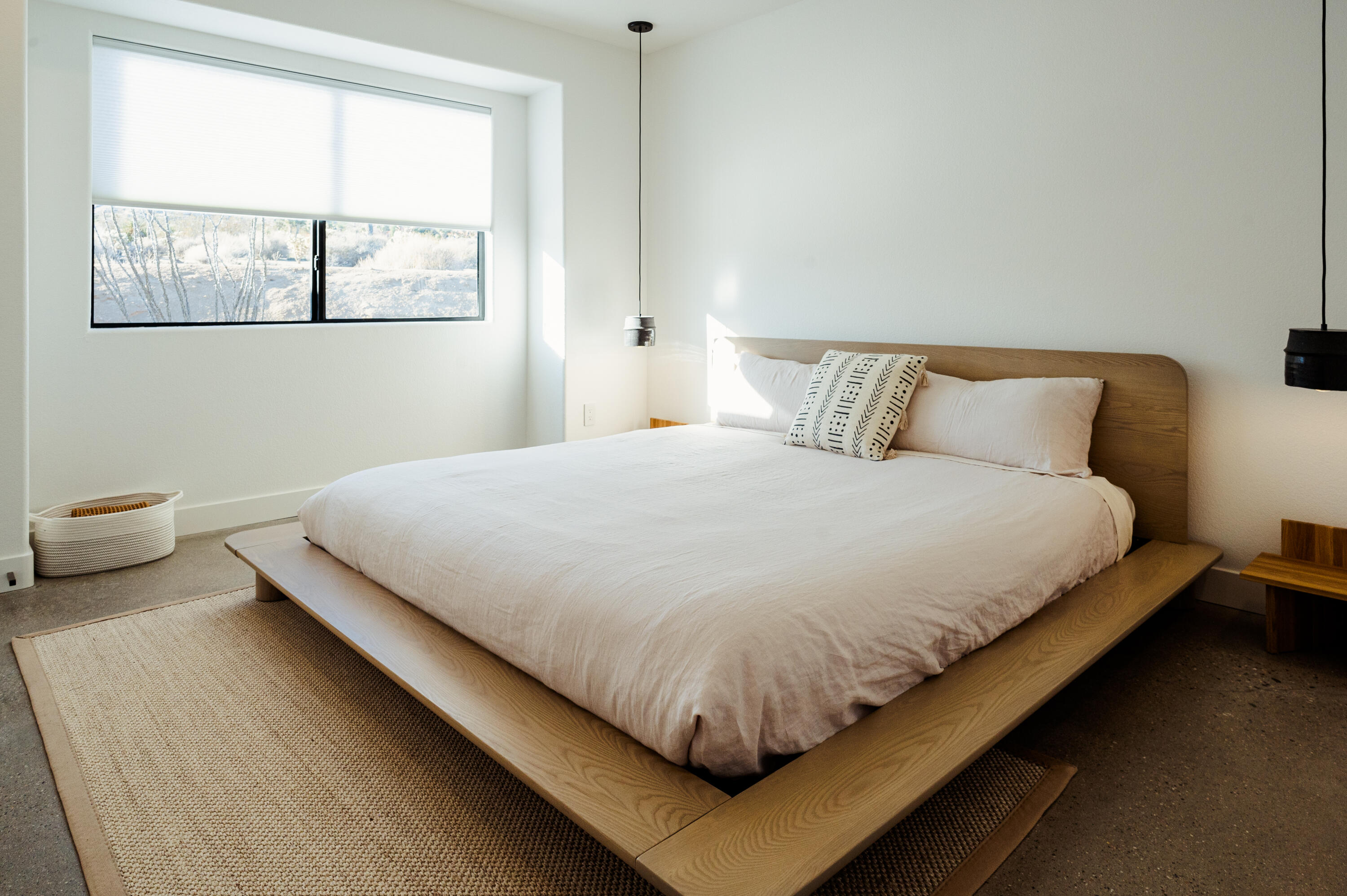 60633 Pueblo Trail Joshua Tree, CA 92252 - Photo 40 of 65 a large bed sitting in a bedroom next to a window