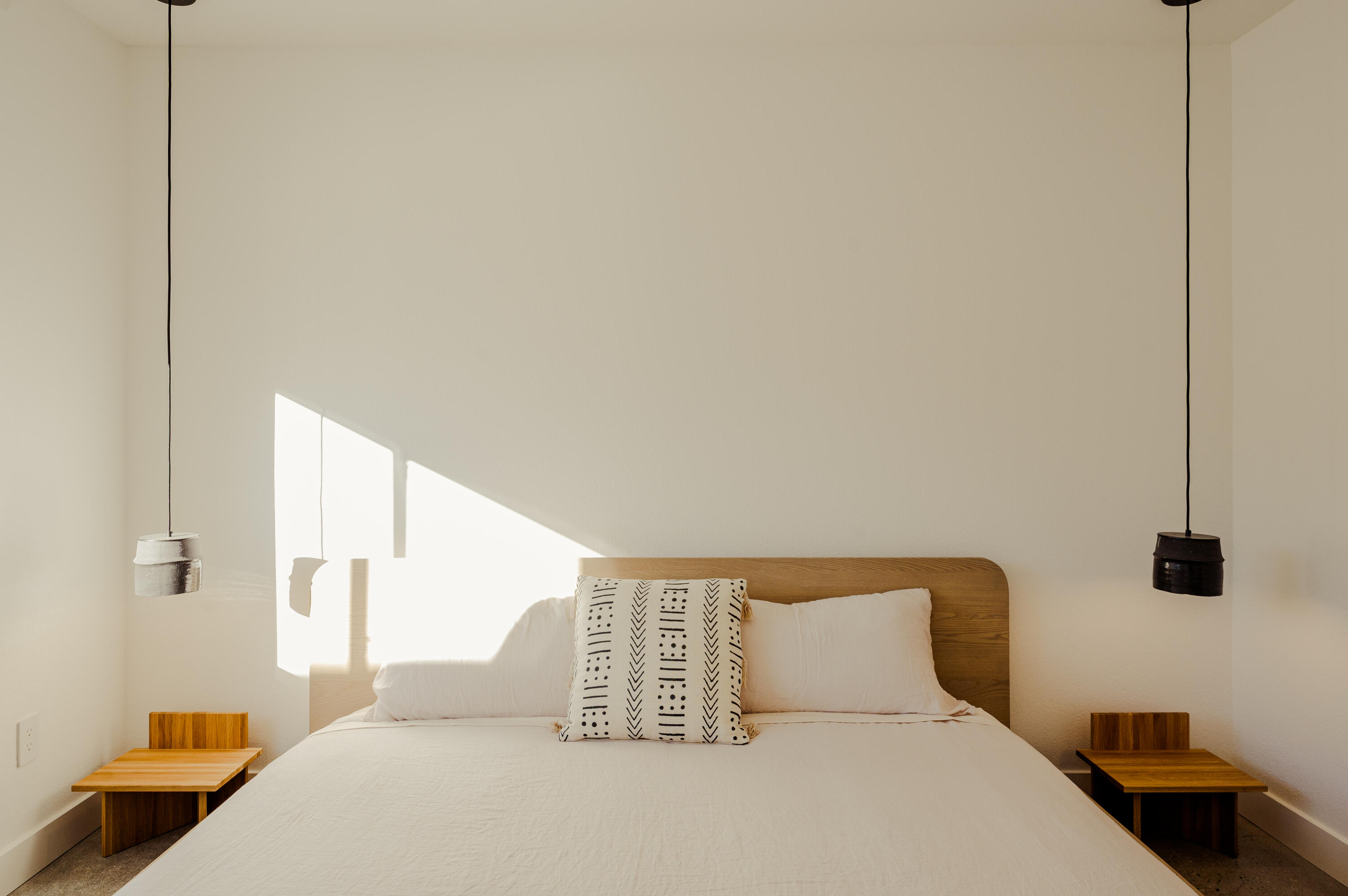 60633 Pueblo Trail Joshua Tree, CA 92252 - Photo 41 of 65 a bedroom with a bed and a night stand