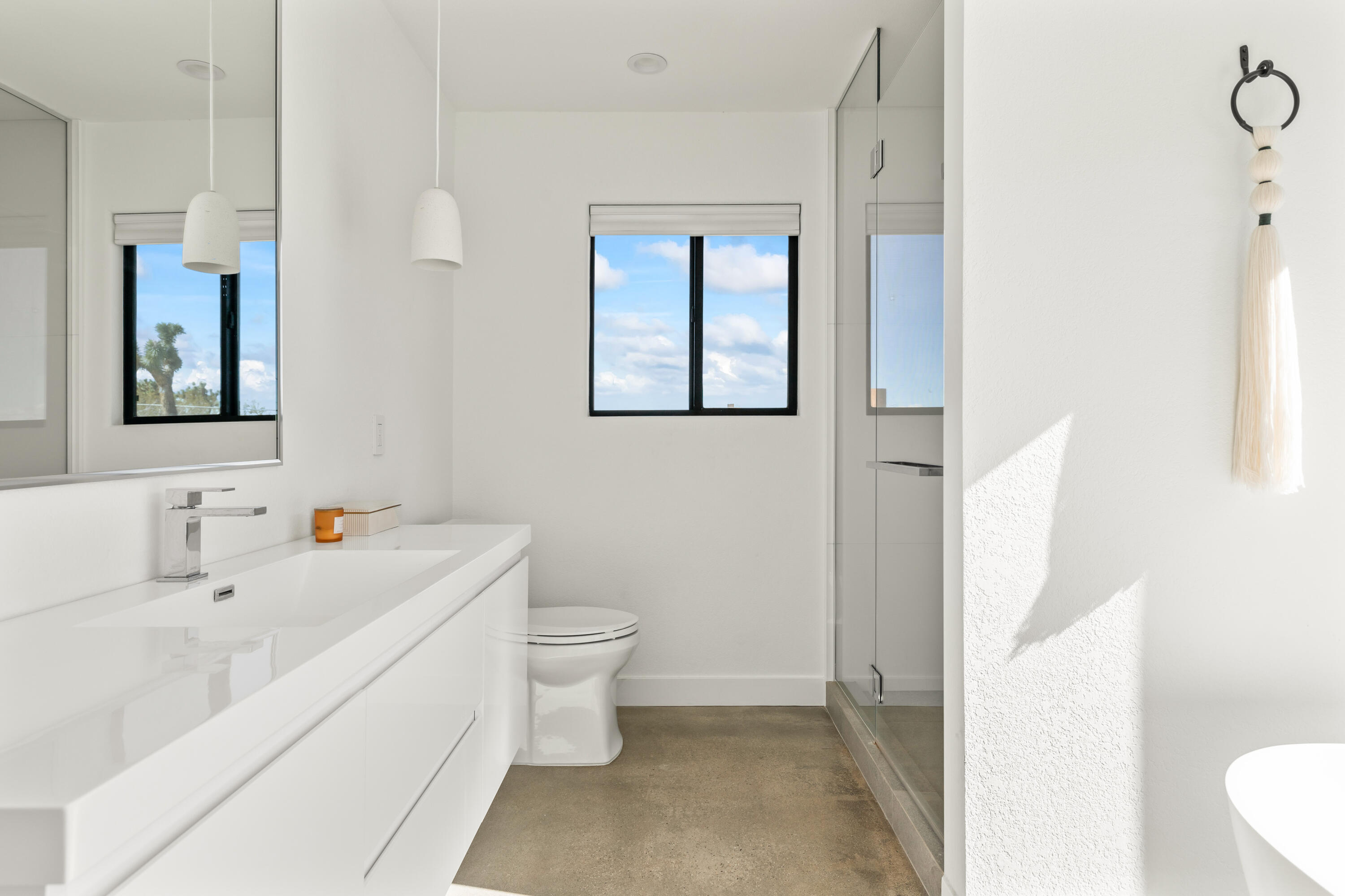 60633 Pueblo Trail Joshua Tree, CA 92252 - Photo 48 of 65 a bathroom with a sink a toilet and mirror