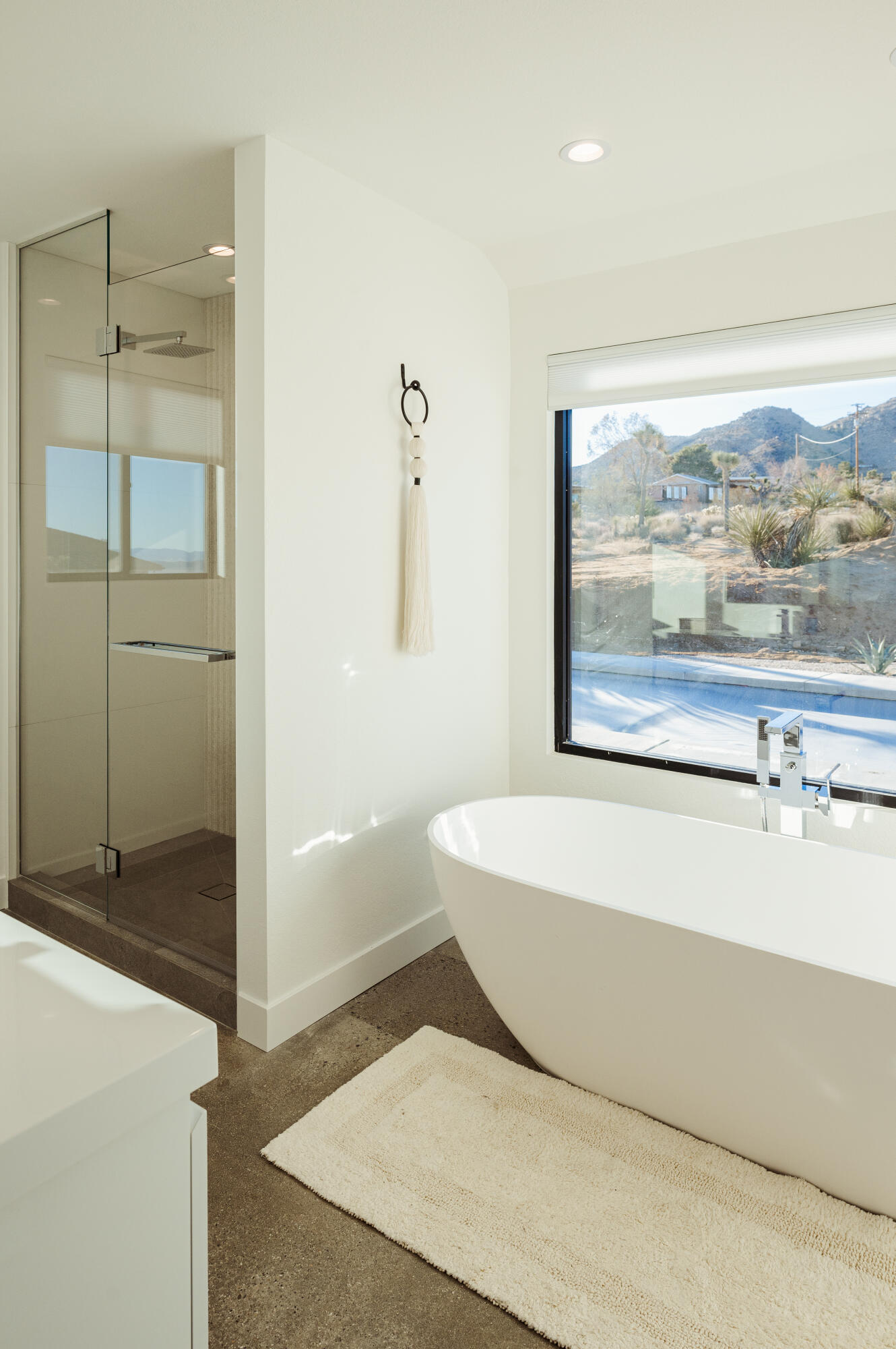 60633 Pueblo Trail Joshua Tree, CA 92252 - Photo 50 of 65 a bathroom with a bathtub and a shower