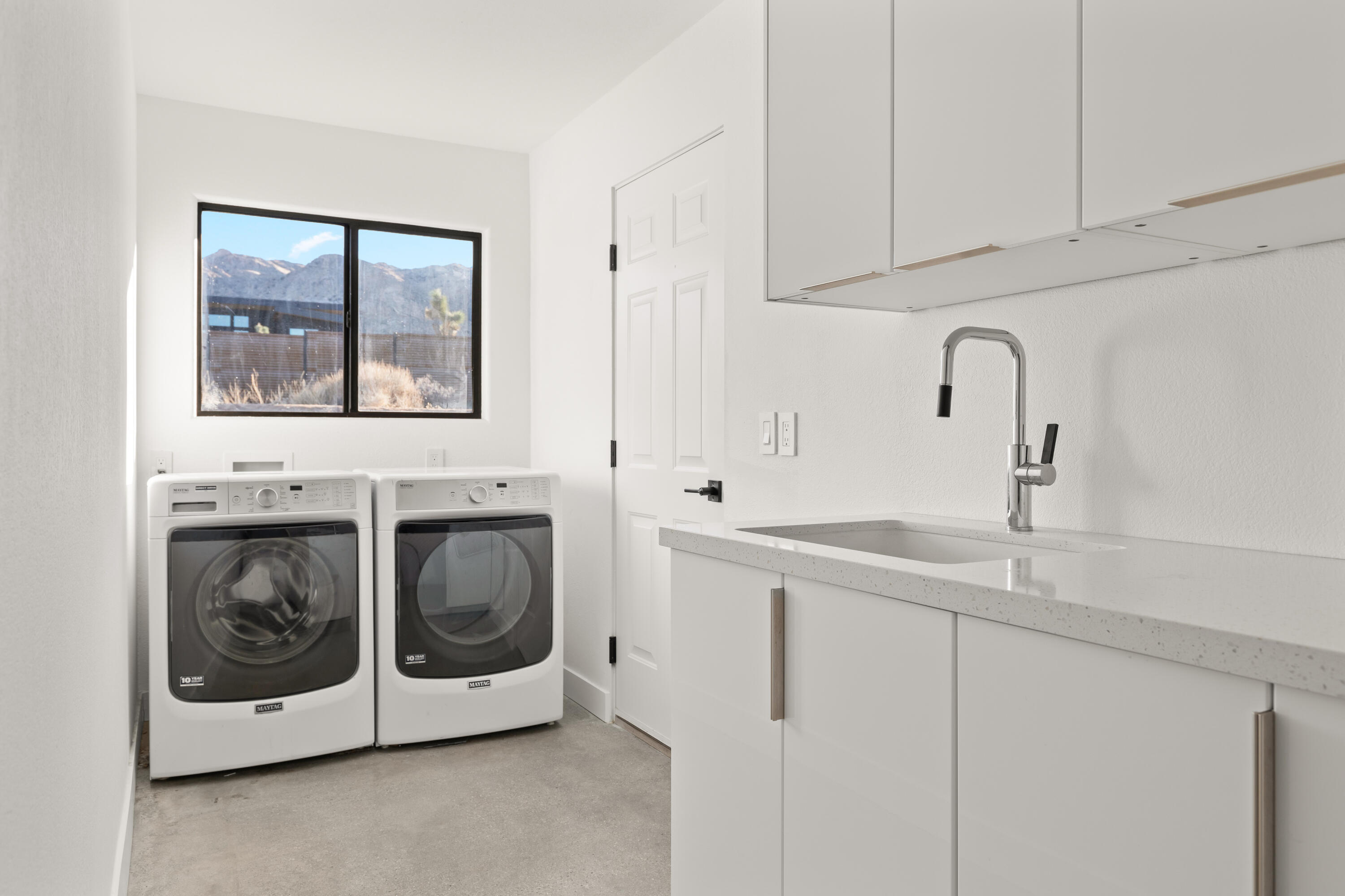60633 Pueblo Trail Joshua Tree, CA 92252 - Photo 52 of 65 a utility room with sink dryer and washer