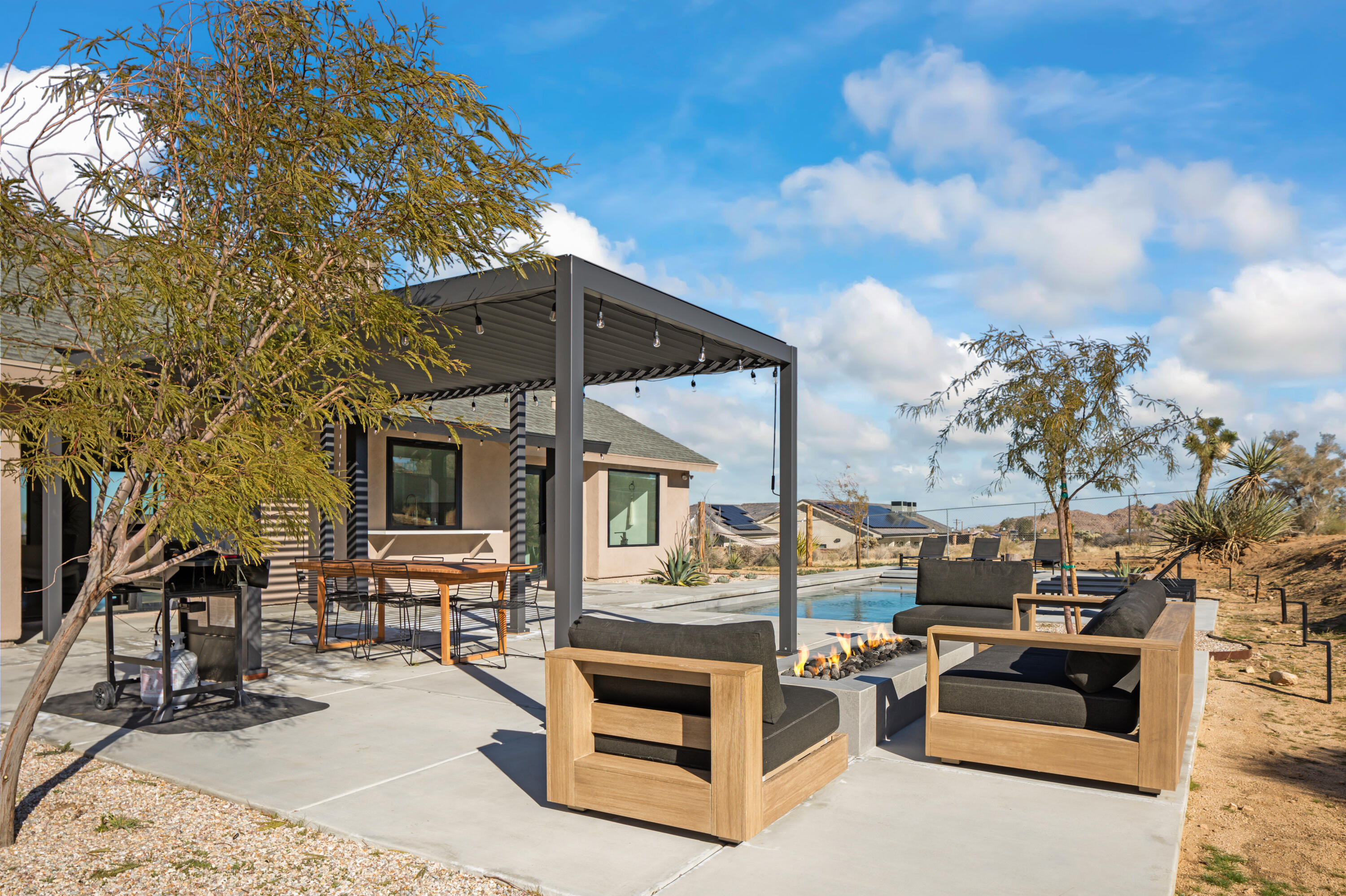 60633 Pueblo Trail Joshua Tree, CA 92252 - Photo 58 of 65 a view of outdoor space yard deck patio and fire pit