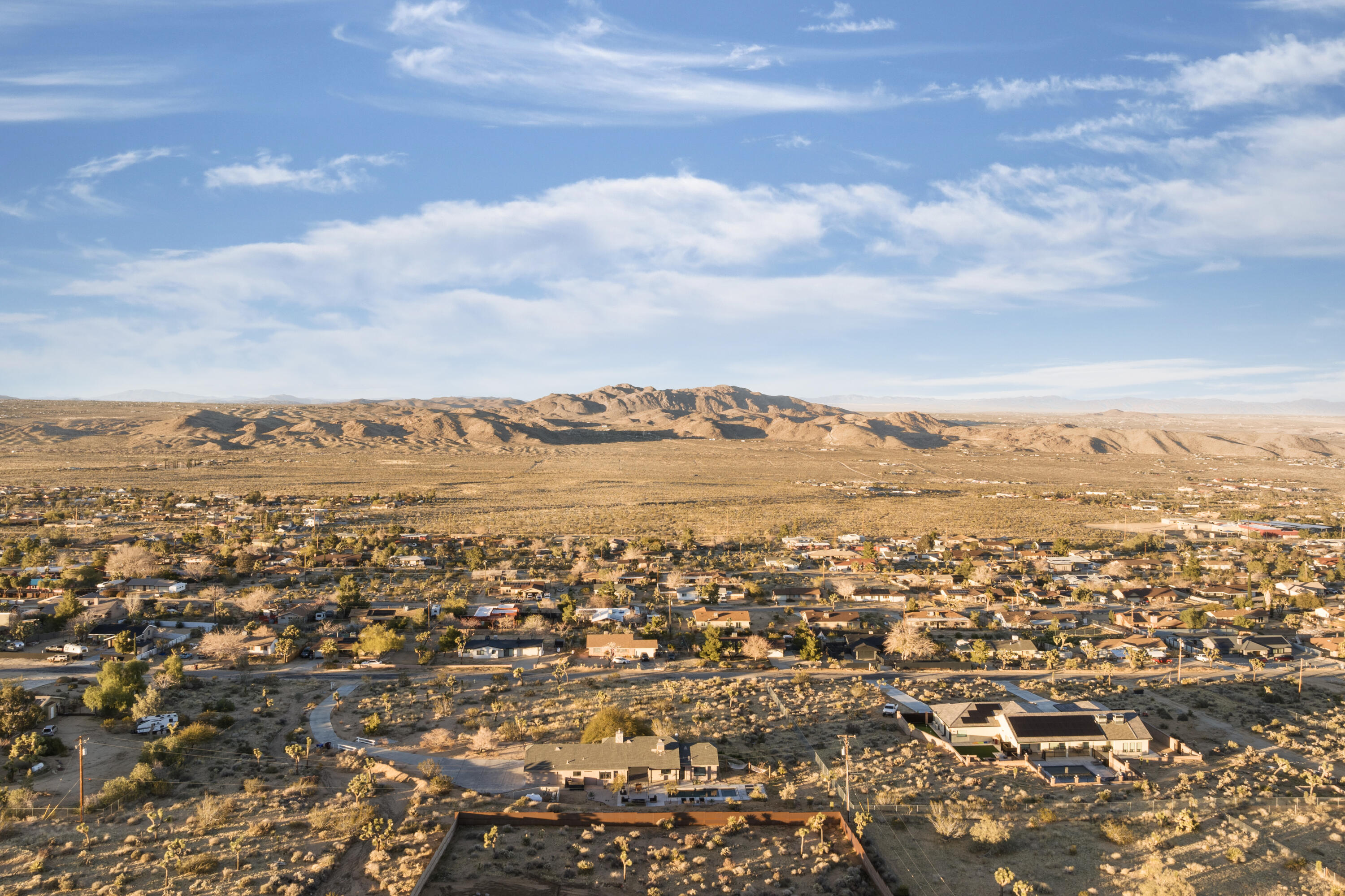 60633 Pueblo Trail Joshua Tree, CA 92252 - Photo 63 of 65 an aerial view of residential houses with outdoor space