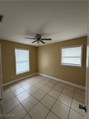 a view of an empty room and window